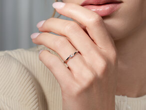Anillo de compromiso Twist en 9K oro rosa con diamante 0,03ct
